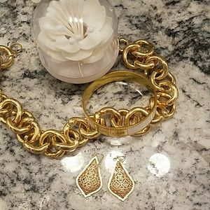 Kendra Scott rose gold and gold earrings